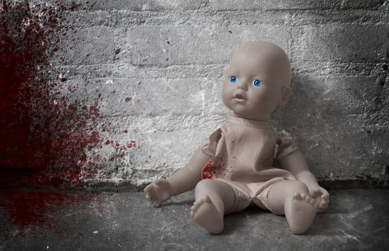 Concept of child abuse - Bloody doll