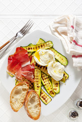 healthy summer salad with grilled zucchini, mozzarella and prosc