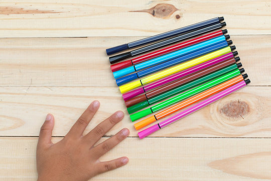 Colorful pencils background on wooden floor