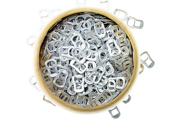 Ring pull aluminum of cans in wooden bowl on white background