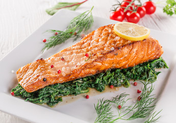 Salmon steak on white plate