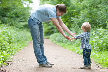 Father gives hand the son