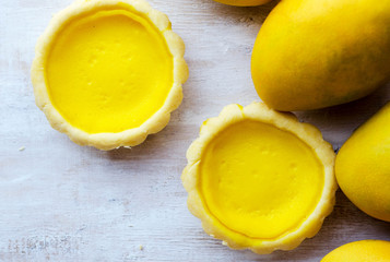 French tart with mango on white background