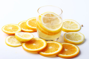 drink and stack of citrus fruits slices.