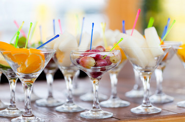 Fresh fruit cuts in champagne party glasses