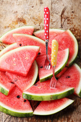 Slice of fresh watermelon on wooden background