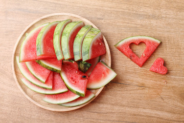 Slices of fresh watermelon with heart shape pieces