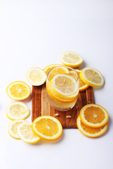 drink and stack of citrus fruits slices.