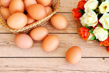 Eggs in the basket on wooden background