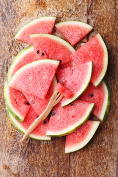 Slice of fresh watermelon on wooden background