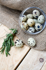 Quail eggs, a bunch of rosemary and burlap