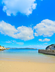 golden shore under a cloudy sky in Sardinia