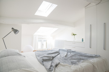 white bedroom with a lot of light