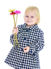 Autumn portrait , blonde girl with bouquet of flowers