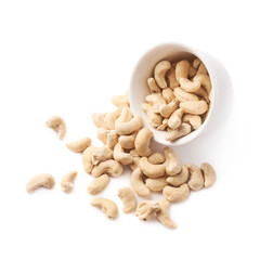 Cup filled with the cashew nuts isolated