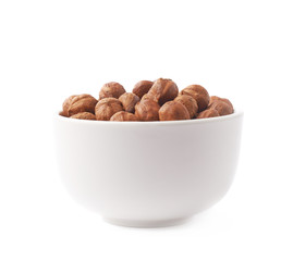 Cup filled with the hazelnuts isolated