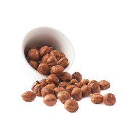 Cup filled with the hazelnuts isolated