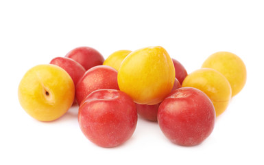 Pile of yellow and red plums