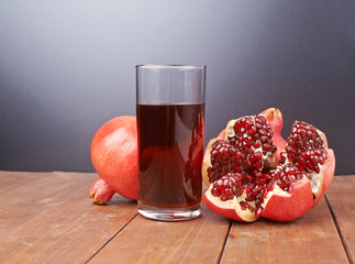 Pomegranate fruit next to the glass