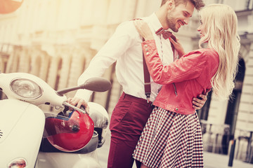 Young couple kissing each other on the street