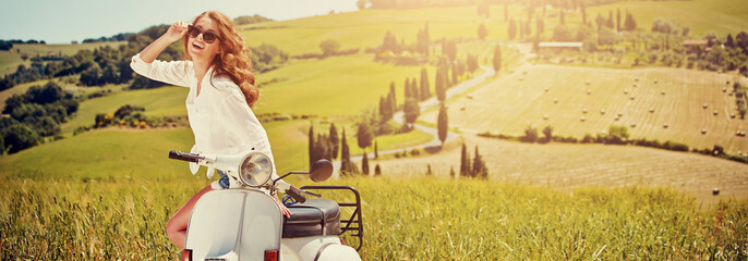 Portrait of summer girl on scooter - Outdoor on Tuscany hiills.R © ZoomTeam