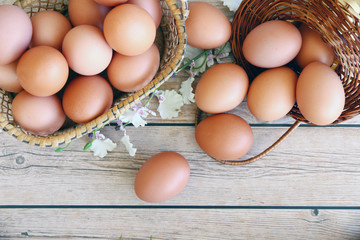 Eggs in the basket on wooden background