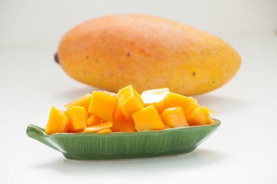 Golden mango cubes closeup and mango 