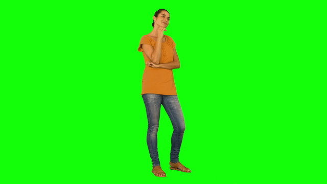 Casual woman standing and thinking