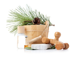 Wooden bucket with ladle for the sauna and stack of clean towels