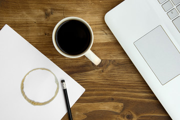 Notebook with text to do list on table with coffee and notebook