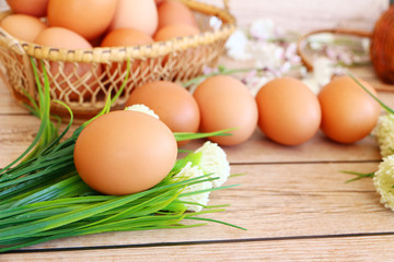 Eggs in the basket on wooden background