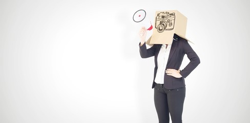 Composite image of anonymous businesswoman holding a megaphone