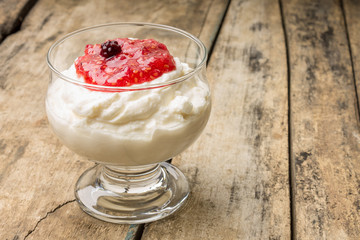Dairy sweet dessert with raspberry jam and Fresh blueberry