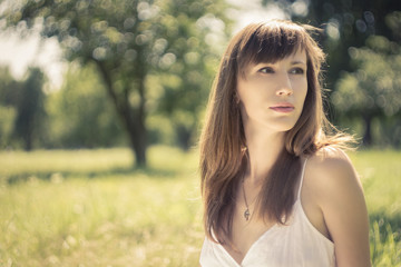 Beauty young woman in summer park