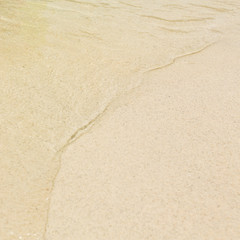 Sea wave and sand beach.