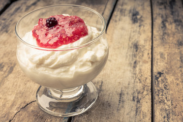 Dairy sweet dessert with raspberry jam and Fresh blueberry