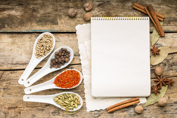 Menu background. Recipe notepad with diversity of spices and herb.