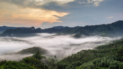 Layer of mountains in the mist at sunrise time, Baan Nai Wong, Ranong Province, Thailand