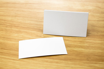 Blank Business card mock up on light wooden table, Business corp