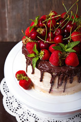 Delicious cake with strawberry, cherry and chocolate decoration