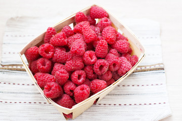 Basket with a raspberry