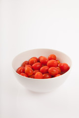 Red cherry tomatoes in a bowl