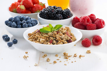 delicious and healthy breakfast with berries on white wood