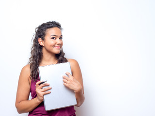 Fototapeta na wymiar Attractive Woman Of Color Holds Clipboard