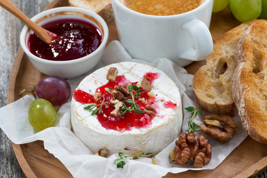 gourmet breakfast- camembert with berry jam, toast, coffee