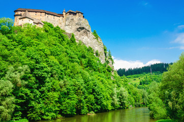 Fototapeta na wymiar Orava Castle background of green trees, Slovakia