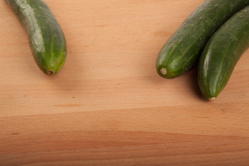 Cucumbers on wooden table
