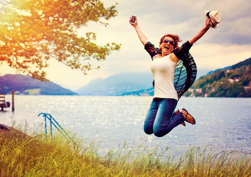 happy girl jumping beside a lake-lakeside 02