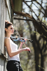beautiful girl with a violin in his hands