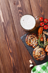 Grilled sausages and beer mug